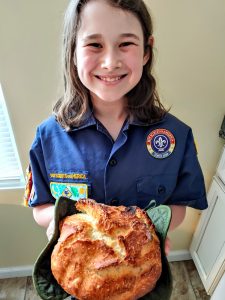 A Scout baked garlic & rosemary bread in a dutch oven!